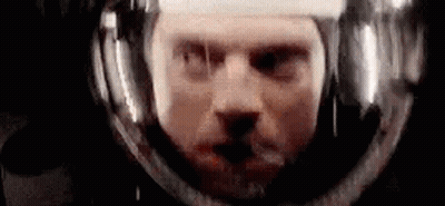 Man's Face In Space Helmet GIF