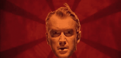 Man's Face On Purple Background With Rays GIF