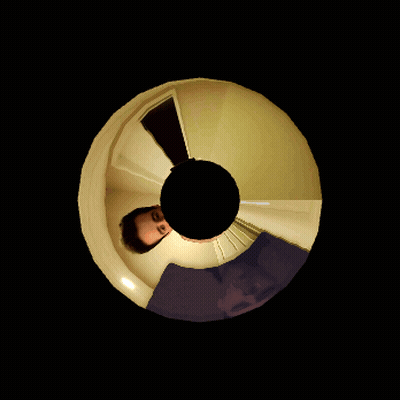 Man's Face Reflected In Black Circle GIF
