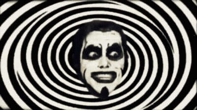 Man's Face Surrounded By Hypnotic Spirals GIF