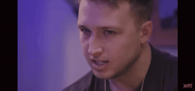 Man's Face With Purple Background And Purple Light GIF