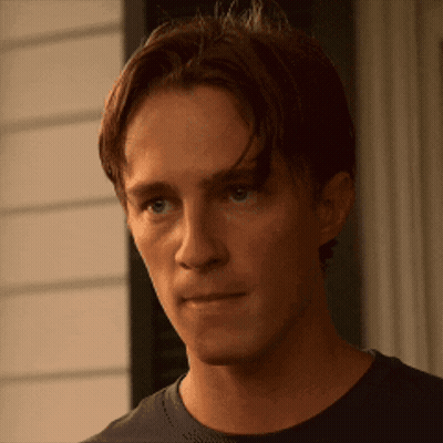 Man's Face With Slight Smile GIF