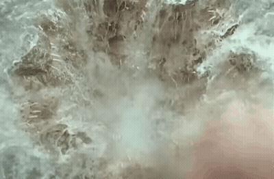 Man's Face With Water Spraying GIF