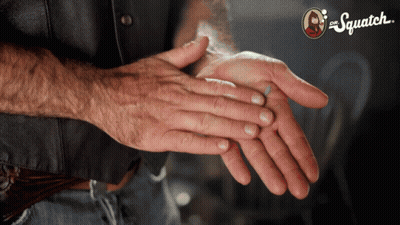 Man's Hands In Front Of Squatch Sign GIF