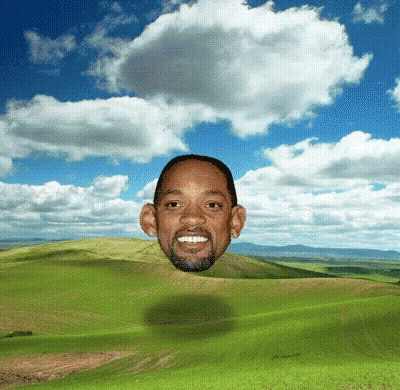 Man's Head Floating Above Green Field GIF