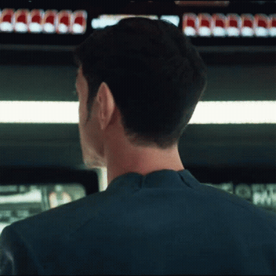 Man's Head In Front Of Coca Cola Cans GIF