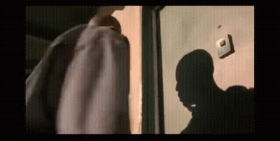 Man's Shadow On Door GIF