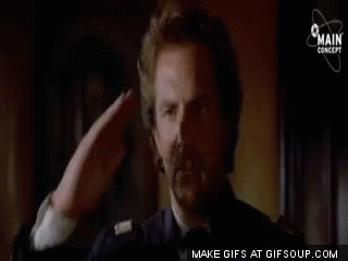 Man Saluting Sitting In Chair GIF