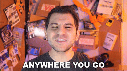 Man Saying Anywhere You Go By Wall Of Items GIF