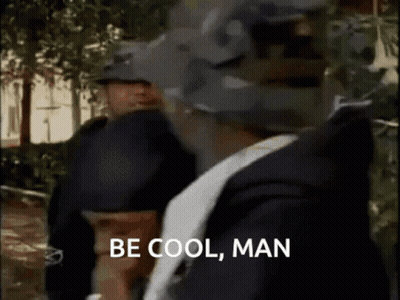 Man Saying Be Cool Man In Front Of Two Police Officers GIF