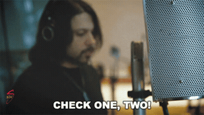 Man Saying Check One Two Into Microphone GIF