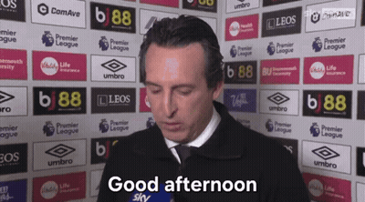 Man Saying Good Afternoon In Front Of Advertisement Wall GIF