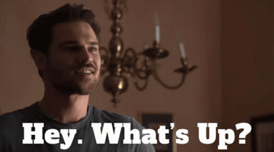 Man Saying Hey What's Up By Candle Chandelier GIF