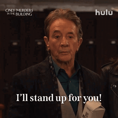Man Saying I'll Stand Up For You Holding Carton GIF
