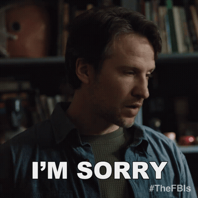 Man Saying I'm Sorry In Front Of Bookcase GIF