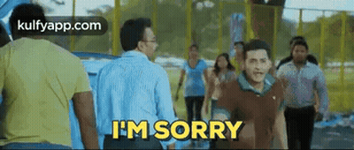 Man Saying I'm Sorry While Walking In Front Of Crowd GIF