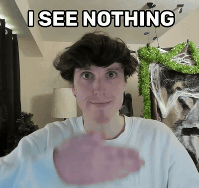Man Saying I See Nothing Beside Cat And Christmas Tree GIF