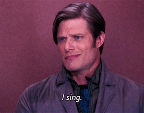 Man Saying I Sing While Wearing Jacket And Tie GIF