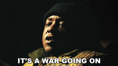 Man Saying It's A War Going On Dark Room GIF