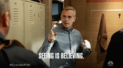 Man Saying Seeing Is Believing Pointing At Another Man GIF