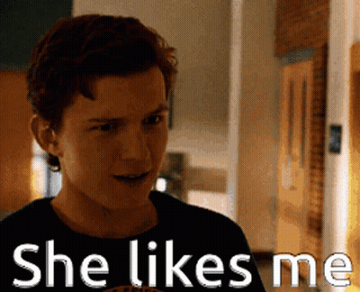 Man Saying She Likes Me In Front Of Door GIF