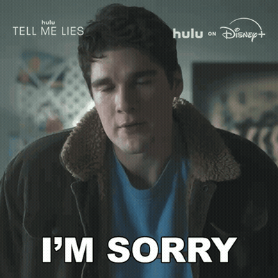 Man Saying Sorry in Jacket and Blue Shirt