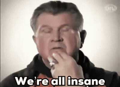 Man Saying We're All Insane While Eating GIF