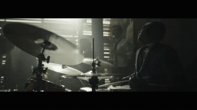 Man Saying Yeah In Front Of Bottles Shelf GIF