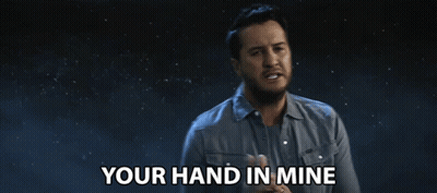 Man Saying Your Hand In Mine In Dark Room GIF