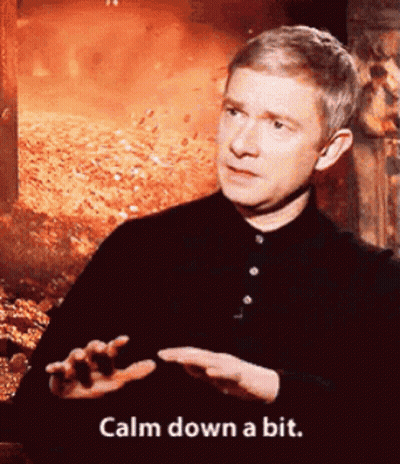 Man Says Calm Down A Bit In Front Of Pile Of Leaves GIF