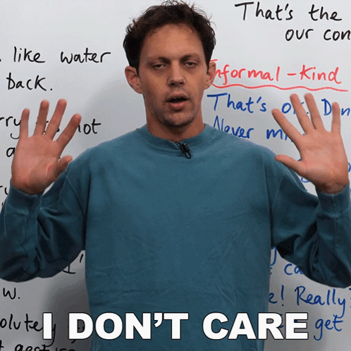 Man Says I Don't Care In Front Of Whiteboard GIF