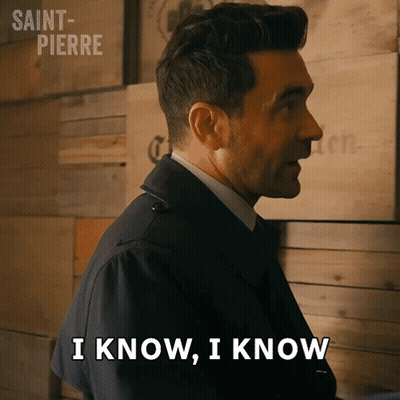 Man Says I Know I Know In Front Of Wooden Wall GIF