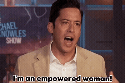 Man Says I'm An Empowered Woman In Front Of Michael Nowles Show Sign