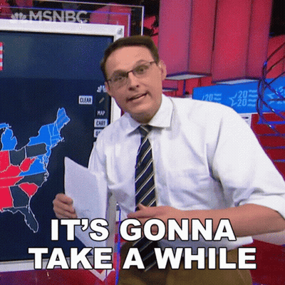 Man Says It's Gonna Take A While In Front Of Map GIF