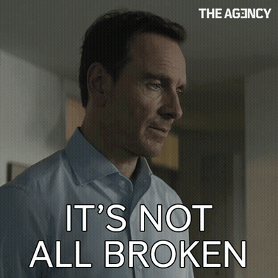 Man Says It's Not All Broken In Front Of The Agency Sign GIF