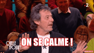 Man Says On Se Calme In Front Of Crowd GIF