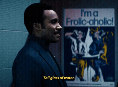 Man Says Tall Glass Of Water In Front Of I'm A Frolic-Aholic Poster GIF