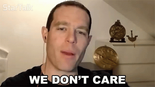 Man Says We Don't Care In Front Of Clock GIF