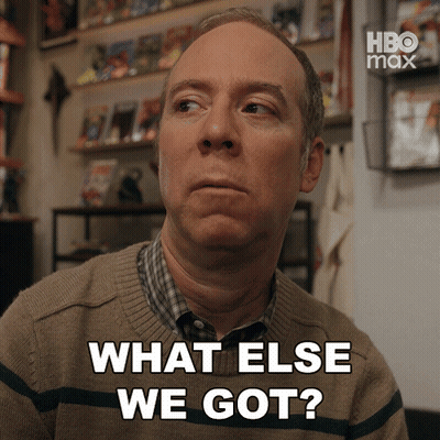Man Says What Else We Got In Front Of Bookshelf GIF