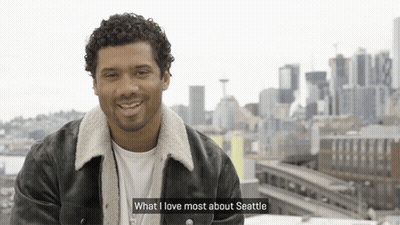 Man Says What I Love Most About Seattle In Front Of Skyline GIF