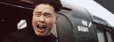 Man Screaming In Front Of Train With Chinese Writing GIF