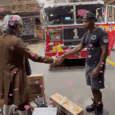 Man Shaking Hands With Fireman In Front Of Fire Truck Number 1 GIF