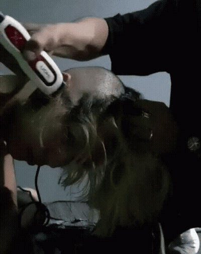 Man Shaving Another Man's Head With Trimmer GIF
