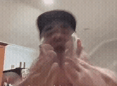 Man Shaving Face With Razor Wearing Hat GIF