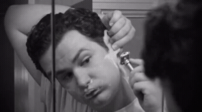 Man Shaving In Front Of Mirror GIF