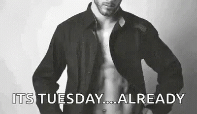 Man Shirtless In Front Of Its Tuesday Sign GIF