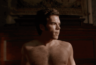 Man Shirtless Looking At Camera GIF