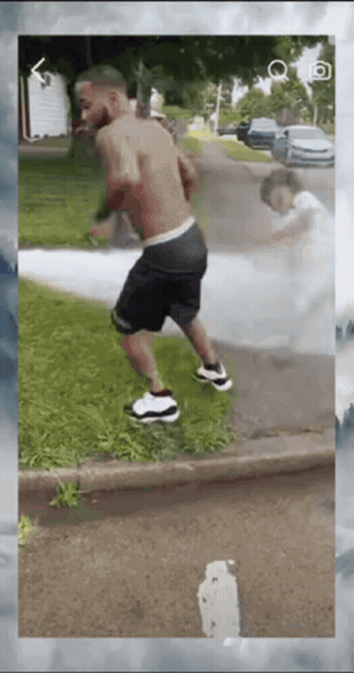 Man Shirtless Walking Down Street GIF