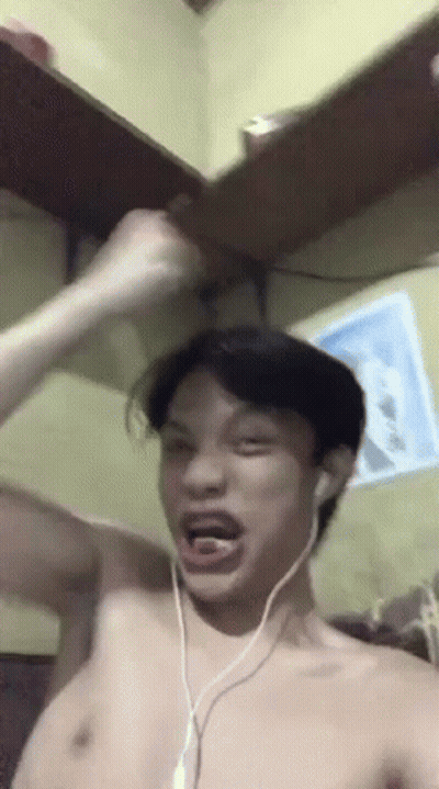Man Shirtless Wearing Headphones Making Funny Face GIF