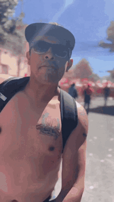Man Shirtless Wearing Sunglasses Hat Backpack GIF